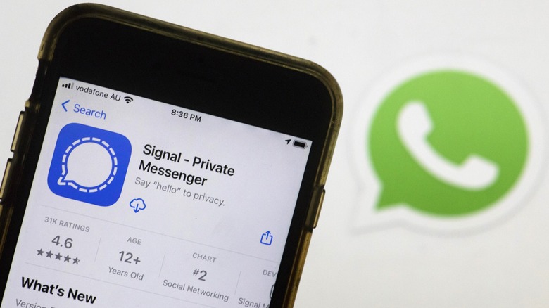 Signal app on the phone with a green phone app behind it