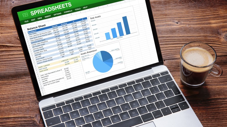 MacBook with spreadsheets on the screen
