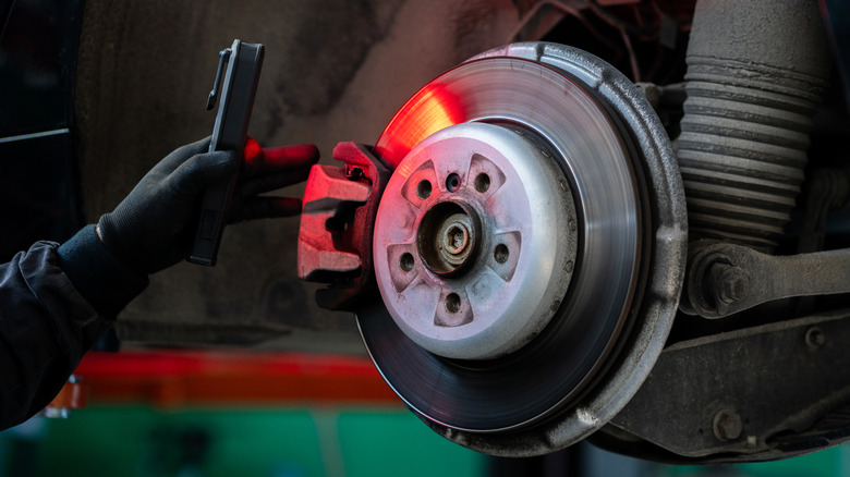 Car brakes getting inspected at shop