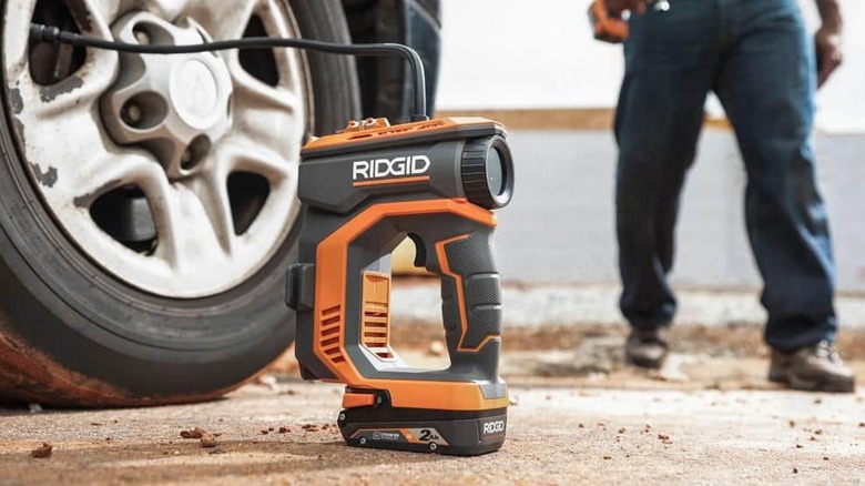 A Ridgid inflator filling a tire.