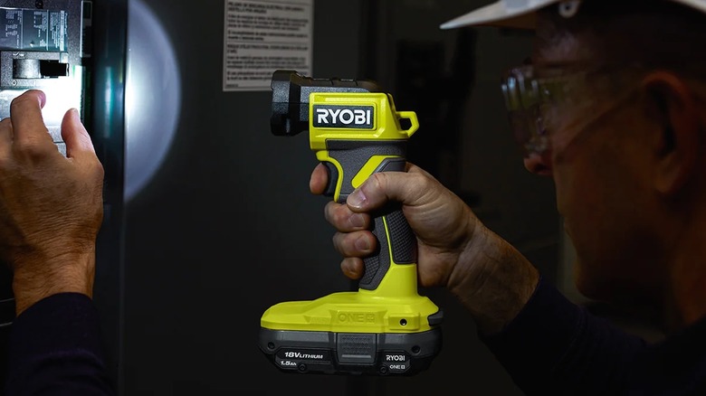 Ryobi cordless LED light bightening up work area in the dark.