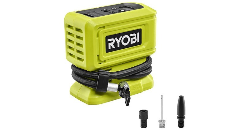 A green Ryobi inflator with two adaptors and one sports needle