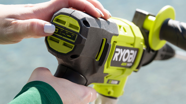 person using Ryobi power cleaner