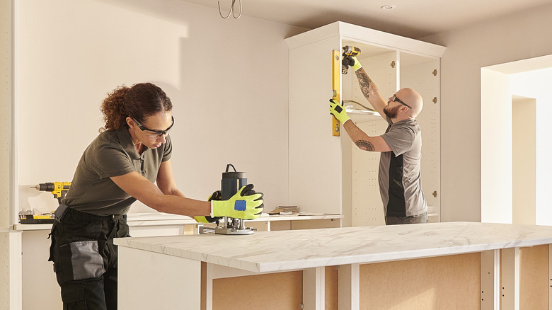two people remodeling kitchen