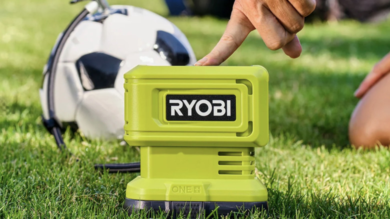 Ryobi inflator pumping air into a soccer ball