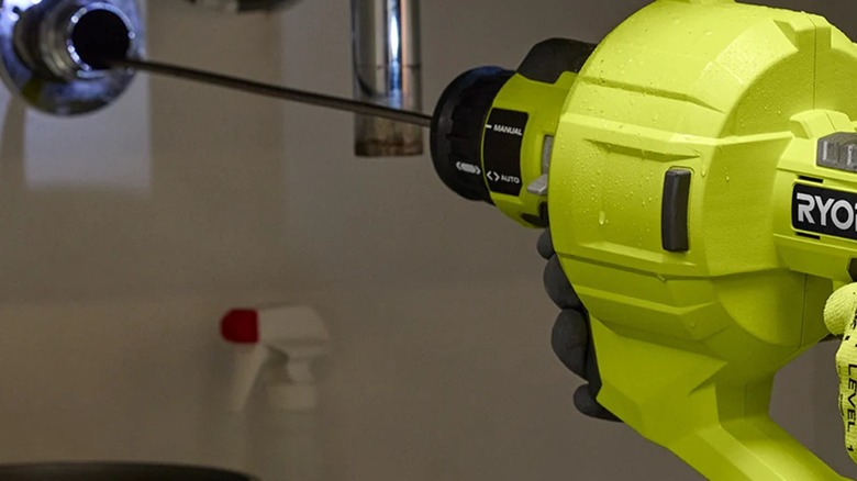Ryobi 18V One+ 25-foot Drain Auger in use