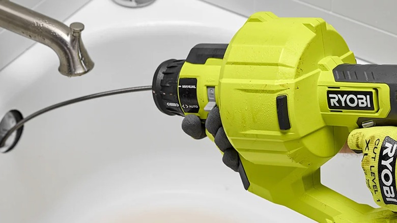 Ryobi 18V One+ 25-foot Drain Auger in use