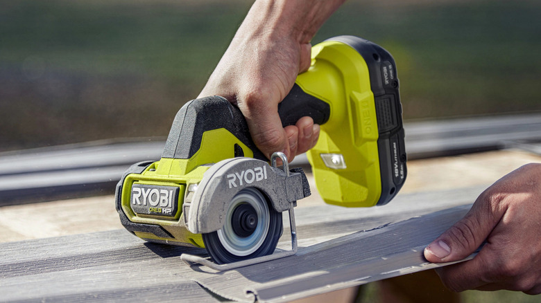 Homeowner using Ryobi compact cut-off tool