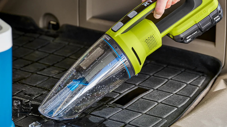 Ryobi cordless hand vacuum being used in car