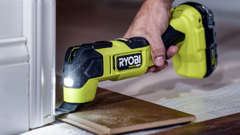Person using Ryobi multi-tools