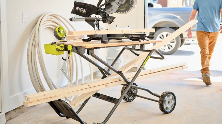 Person setting up a Ryobi speed bench in their garage