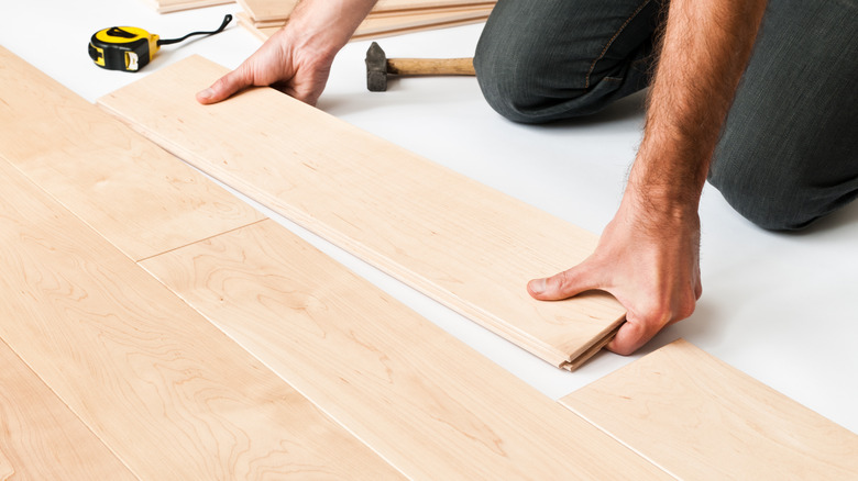 person installing floor