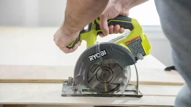 DIYer using a Ryobi circular saw