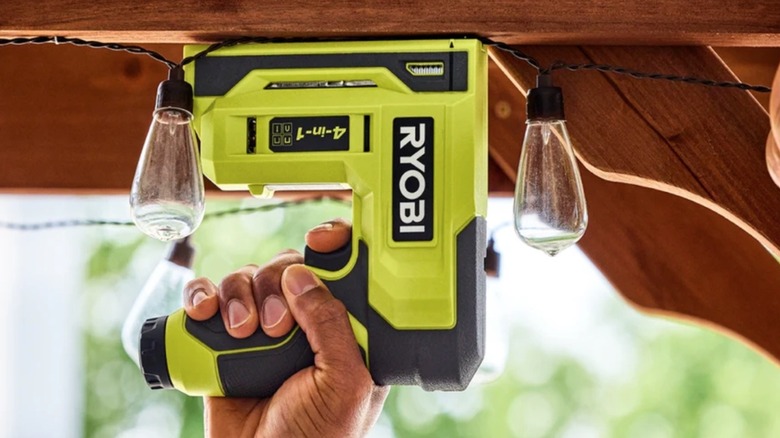 Person using Ryobi Lithium Nailer