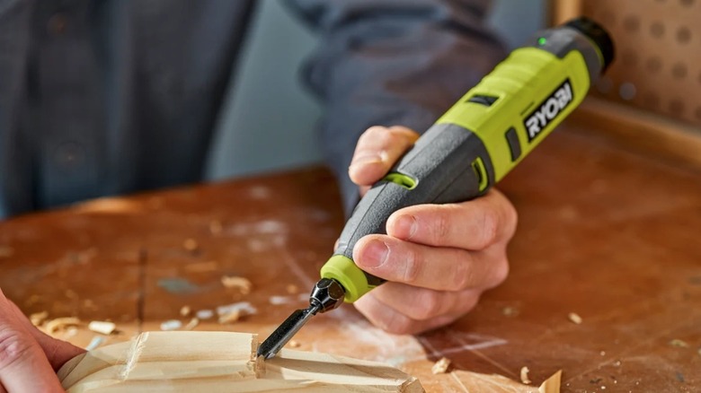 Person using Ryobi Lithium Carver