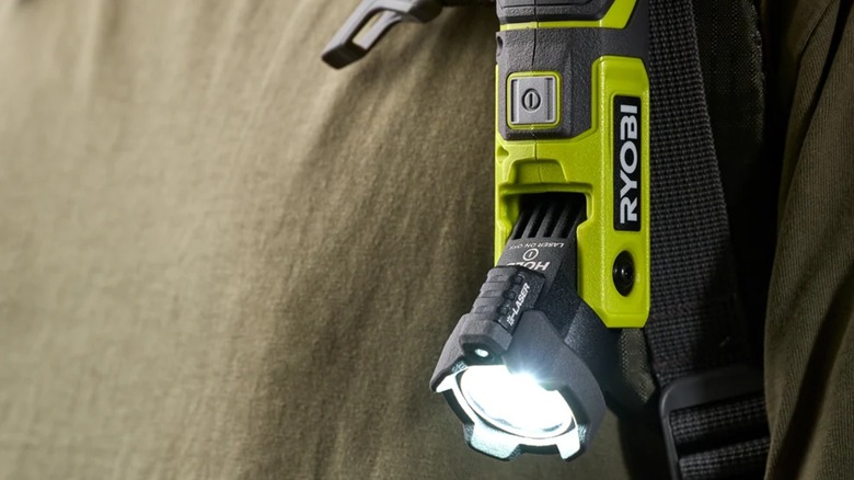 A person wearing LED pivoting laser