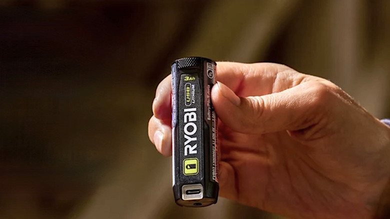 Person holding a 3Ah Ryobi USB Lithium battery