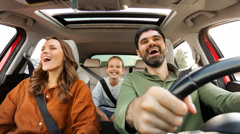 family in car on a road trip
