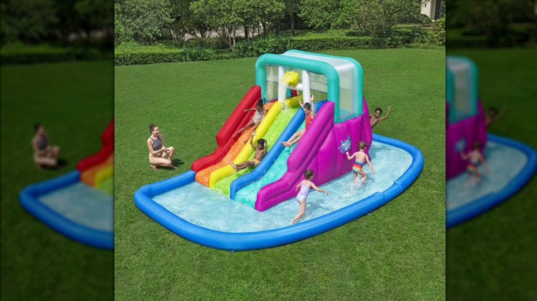 kids playing in H2OGO! Triple Splash Inflatable Water Park
