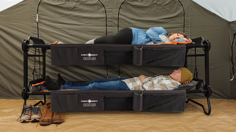 Man and woman using Large Disc-O-Bed Bunkable Cots