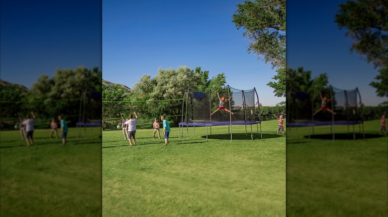 People playing on Skywalker 15' Round Sports Arena Trampoline