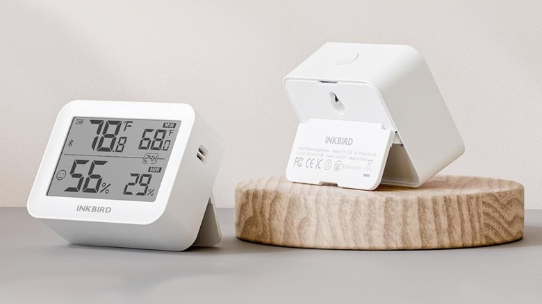 A person monitoring sensor data on their smartphone