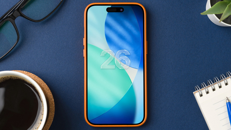 An iPhone on a table with the number 26 on its background.
