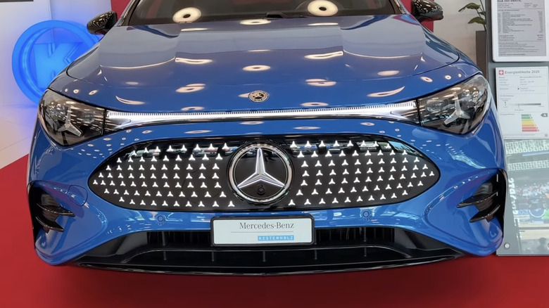 A front-end view of a new blue Mercedes CLA-Class light up star grille.
