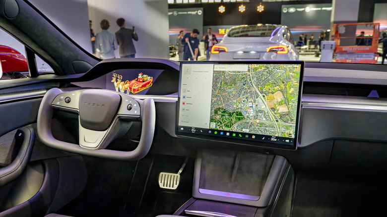 An interior view of a Tesla Model S and the Yoke steering wheel.