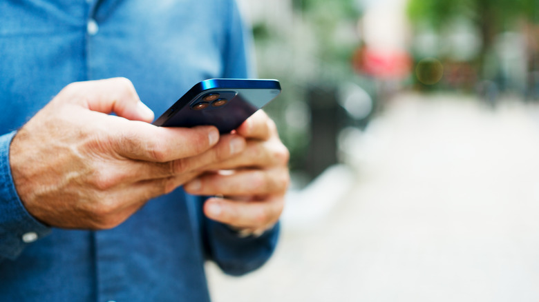 person holding his smartphone in their hand