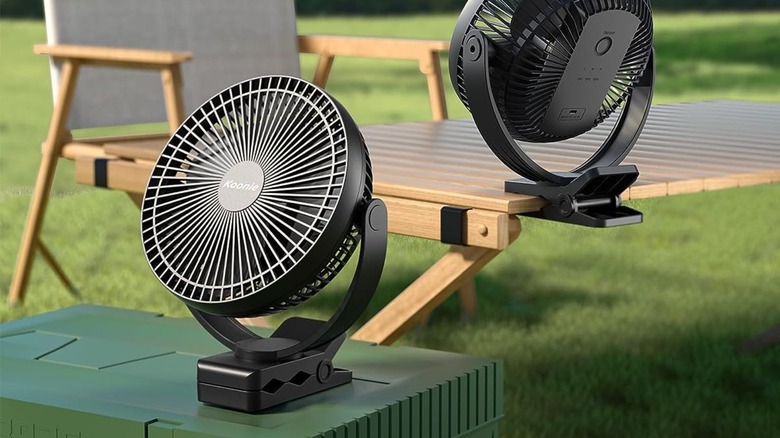 Fan sitting on table and cooler outside