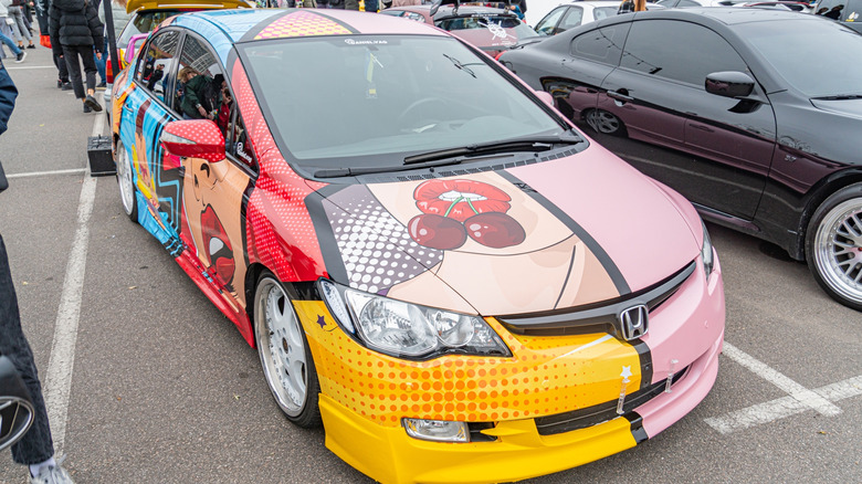 A customized car with a vibrant, custom paint job