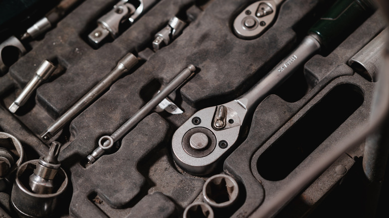 An open box of metal tools.