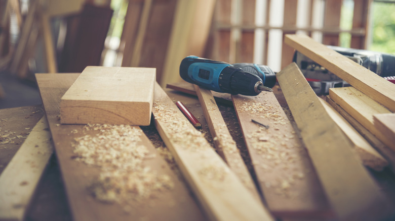 Blocks of wood and tools on a workbench.