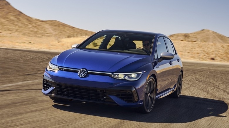 Blue 2022 Volkswagen Golf R driven in desert