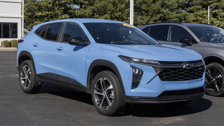 A blue Chevrolet Trax parked in a parking lot.