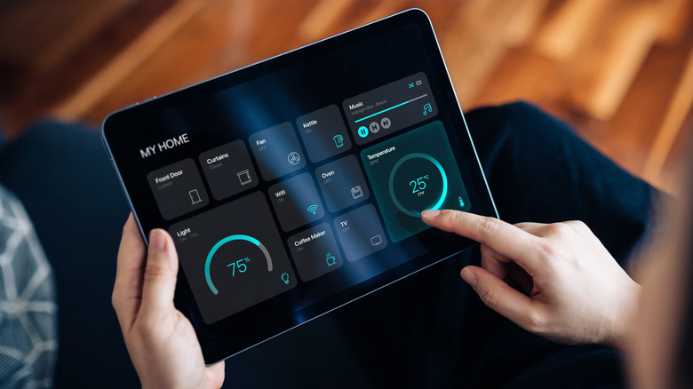Person using a smart tablet display messing with the settings