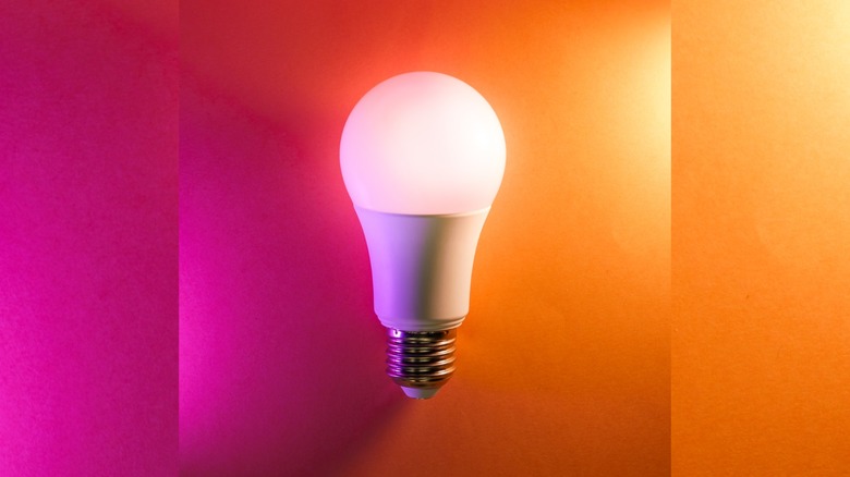 a smart bulb on a pastel background