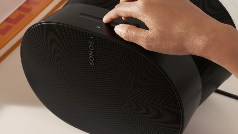 Person using Sonos Era 300 speaker