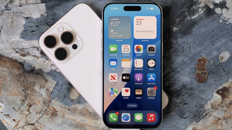 One iPhone on top of another iPhone granite background