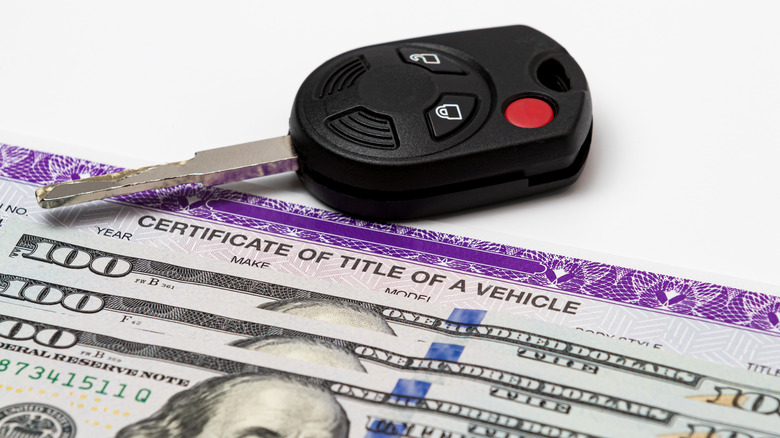 car key, title, and cash