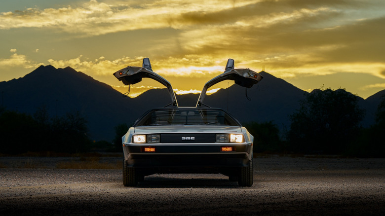 DeLorean parked showing the doors open front view