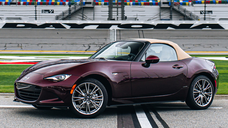 Front 3/4 view of Mazda Miata in trackside setting at Daytona
