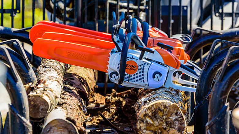 Stihl chainsaws on logs