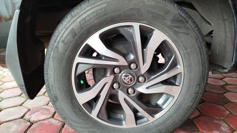 A rear right corner of a Toyota SUV wearing GT Radial tires.