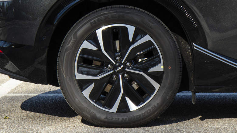 A black Kia EV6 wearing a Nexen tire.