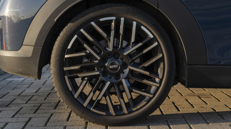 A dark blue Mini wearing a Vredestein tire.