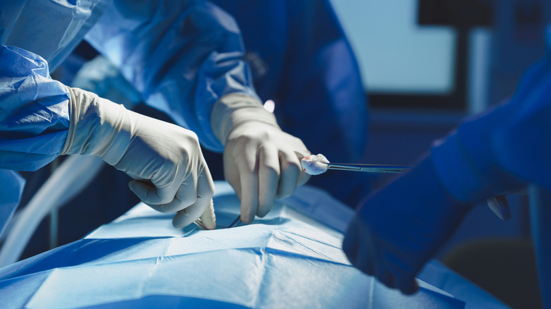 A doctor performing a surgery