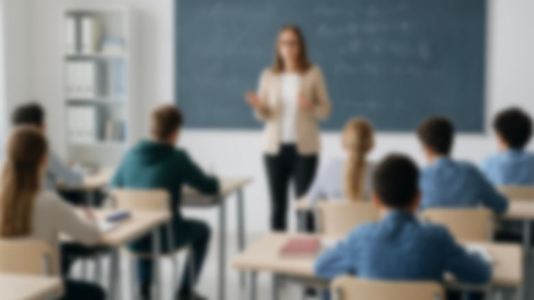 A classroom setting with a teacher and students