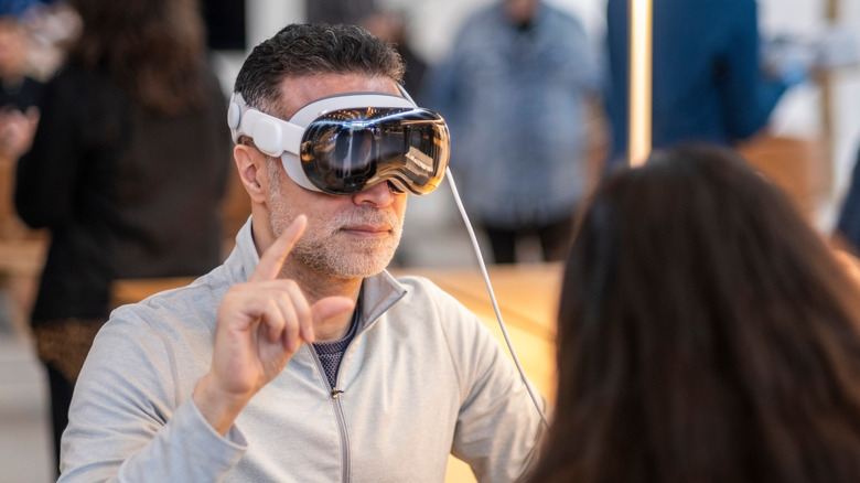 A person wearing the Apple Vision Pro headset